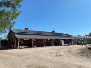 Photo of Running Brook Farms barn with solar panels on roof