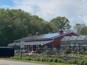 Photo of Running Brook Farms barn with solar panels on roof
