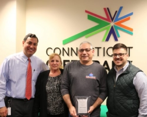 Photo of Home Comfort Solutions staff receiving award