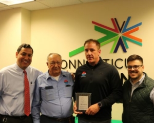 Photo of Viglione Heating and Cooling Inc. staff with award