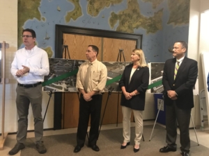 Photo of Craig Flaherty, Ed Gentile, Jayme Stevenson and Bert Hunter at ribbon cutting ceremony.