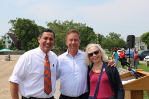 Photo of Bryan Garcia, Governor Lamont, and Green Bank Chair Lonnie Reed smiling for the camera