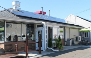 Photo of Westville Seafood in New Haven, CT and its 88 370 watt panel rooftop solar array.